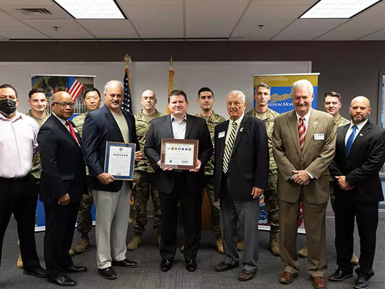 Veteran employees of Freedom Mortgage with members of the Employers Support of The Guard and Reserve (ESGR) committee