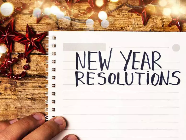 Photo of notepad with New Years Resolutions written at top