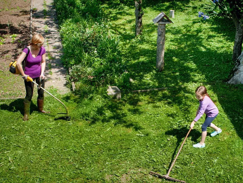 Mother and daughter doing yard work