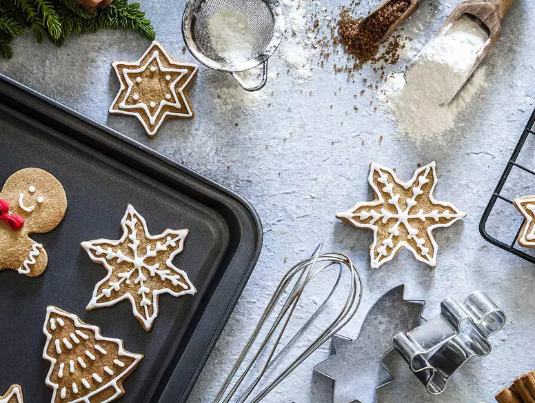 Closeup of holiday cookies being made
