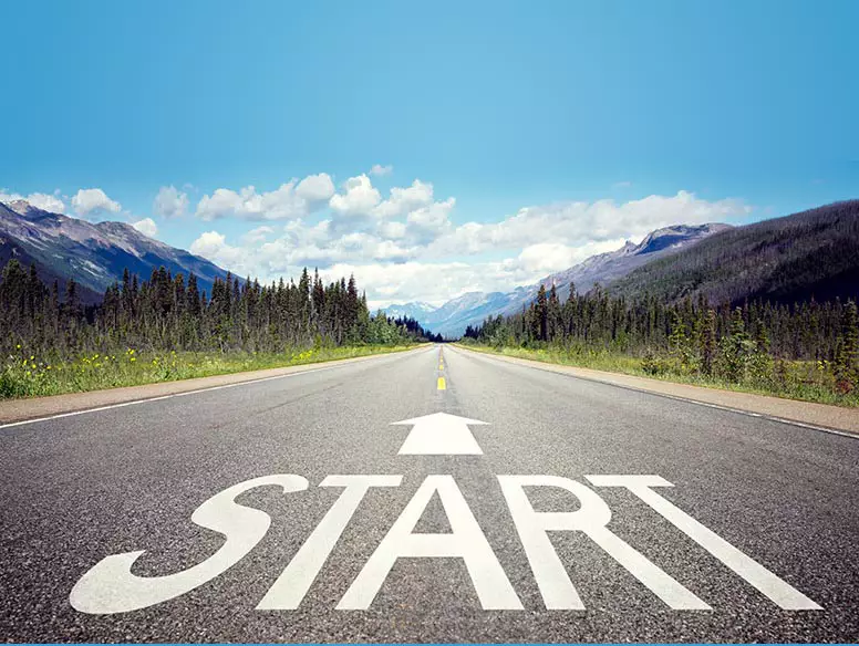 Mountain road with the word Start and an arrow leading forward