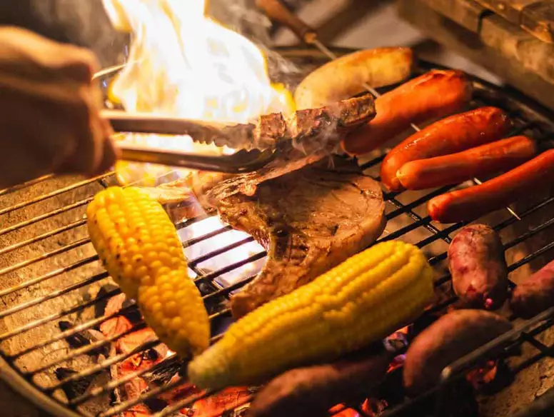 Image of food cooking on a grill